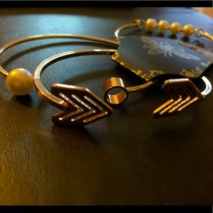 Flamingo pouch and gold bangle set.